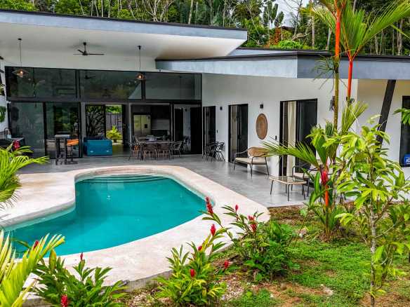 Resort-Style Home with pool, covered patio, and open-air living area surrounded by jungle in Uvita, Costa Rica