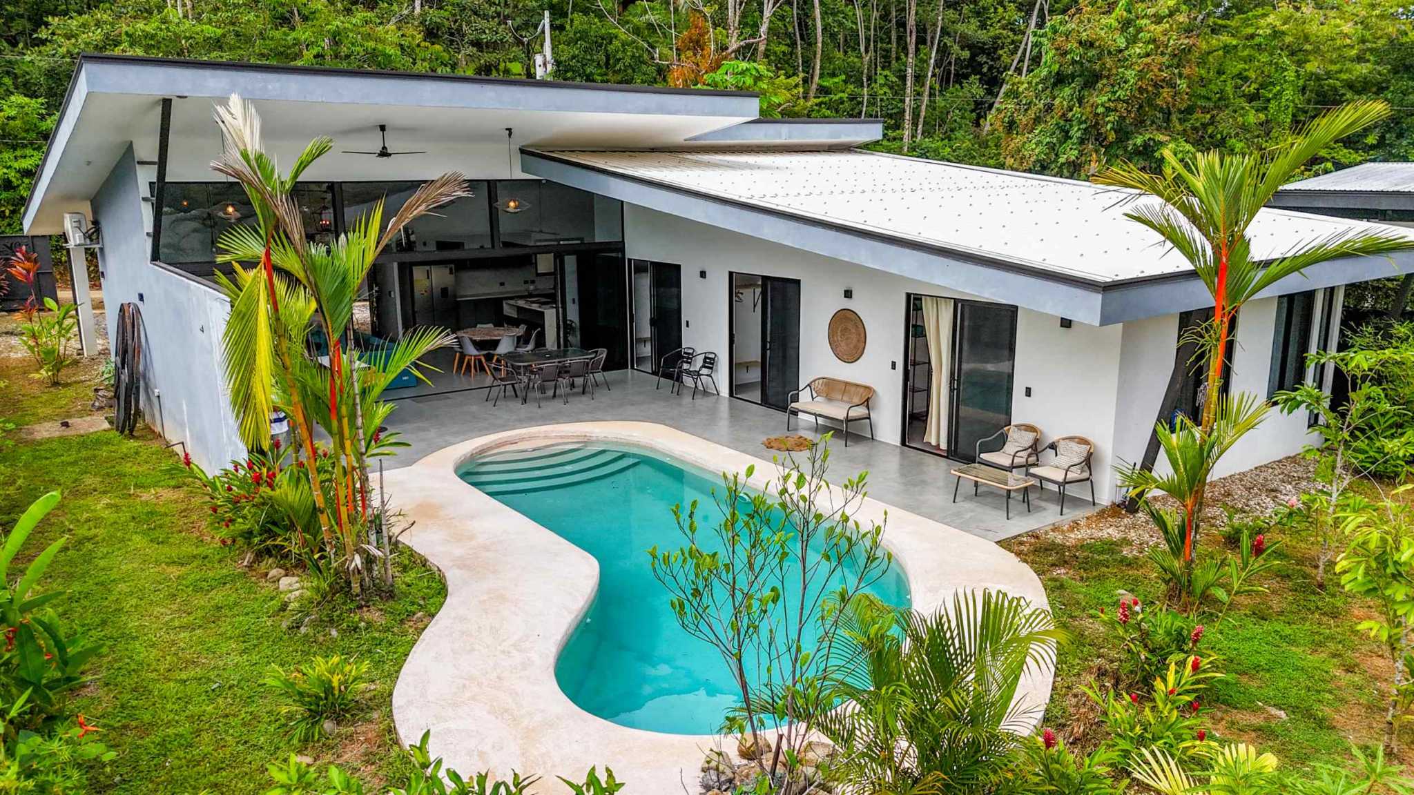 Resort-Style Home with pool, covered patio and lounge seating amid tropical jungle in Uvita, Costa Rica