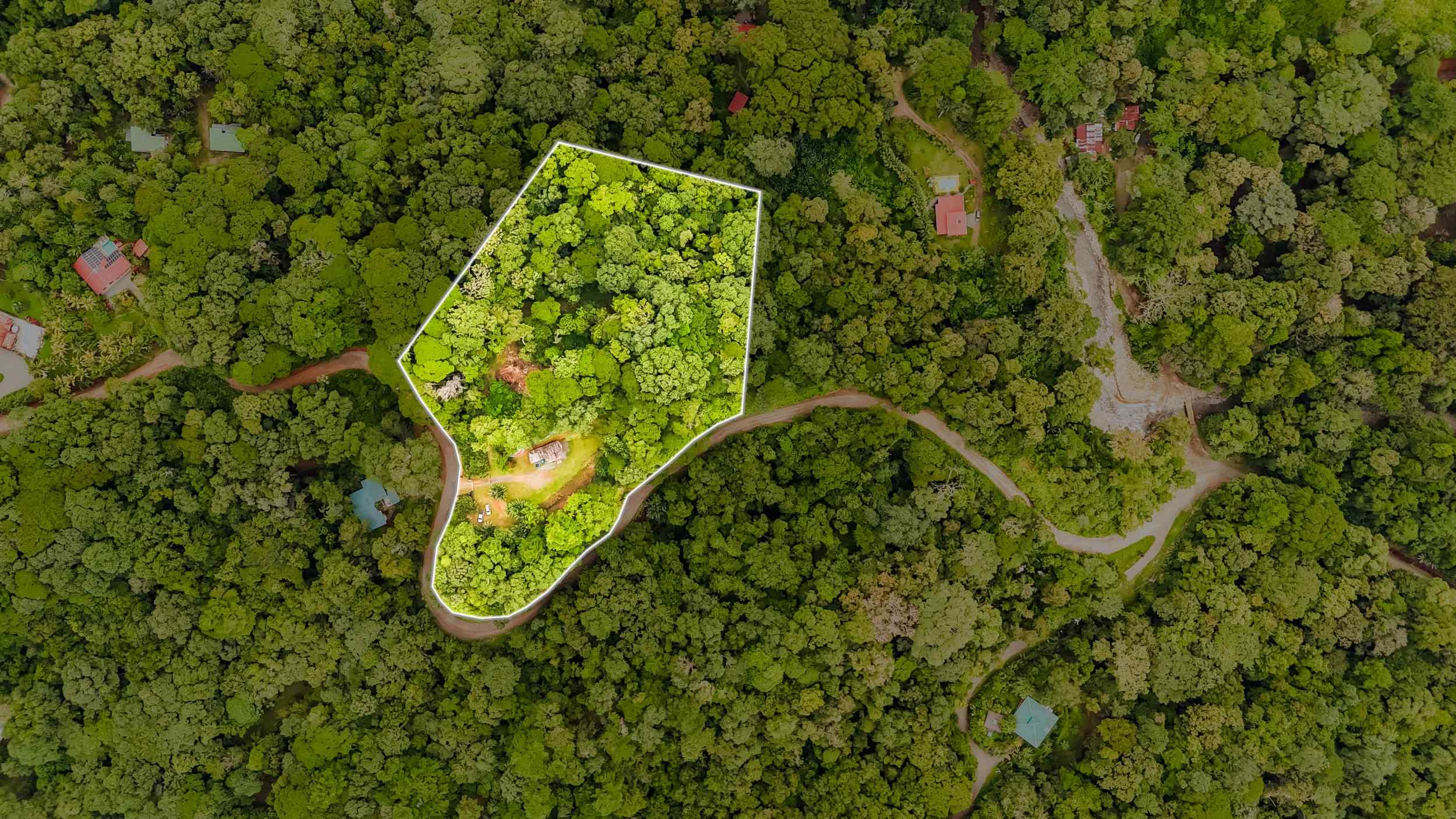 Tranquil 2+ Acre Building Lot with Simple Home and Legal Water in Ojochal Costa Rica