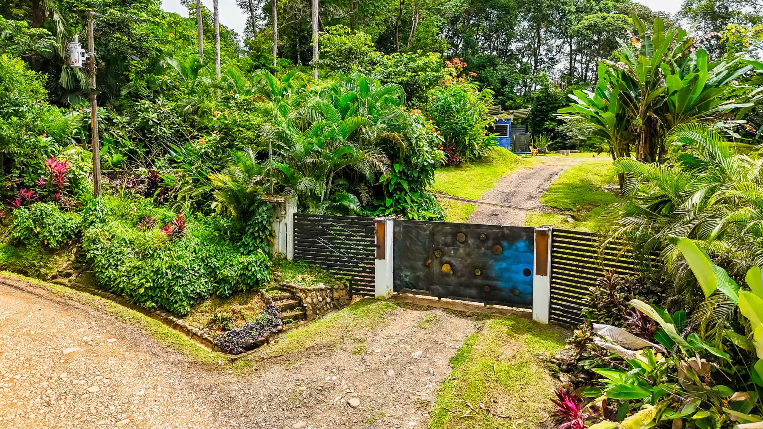 Tranquil 2+ Acre Building Lot with Simple Home and Legal Water in Ojochal Costa Rica