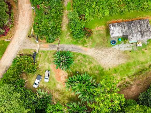 Tranquil 2+ Acre Building Lot with Simple Home and Legal Water in Ojochal Costa Rica