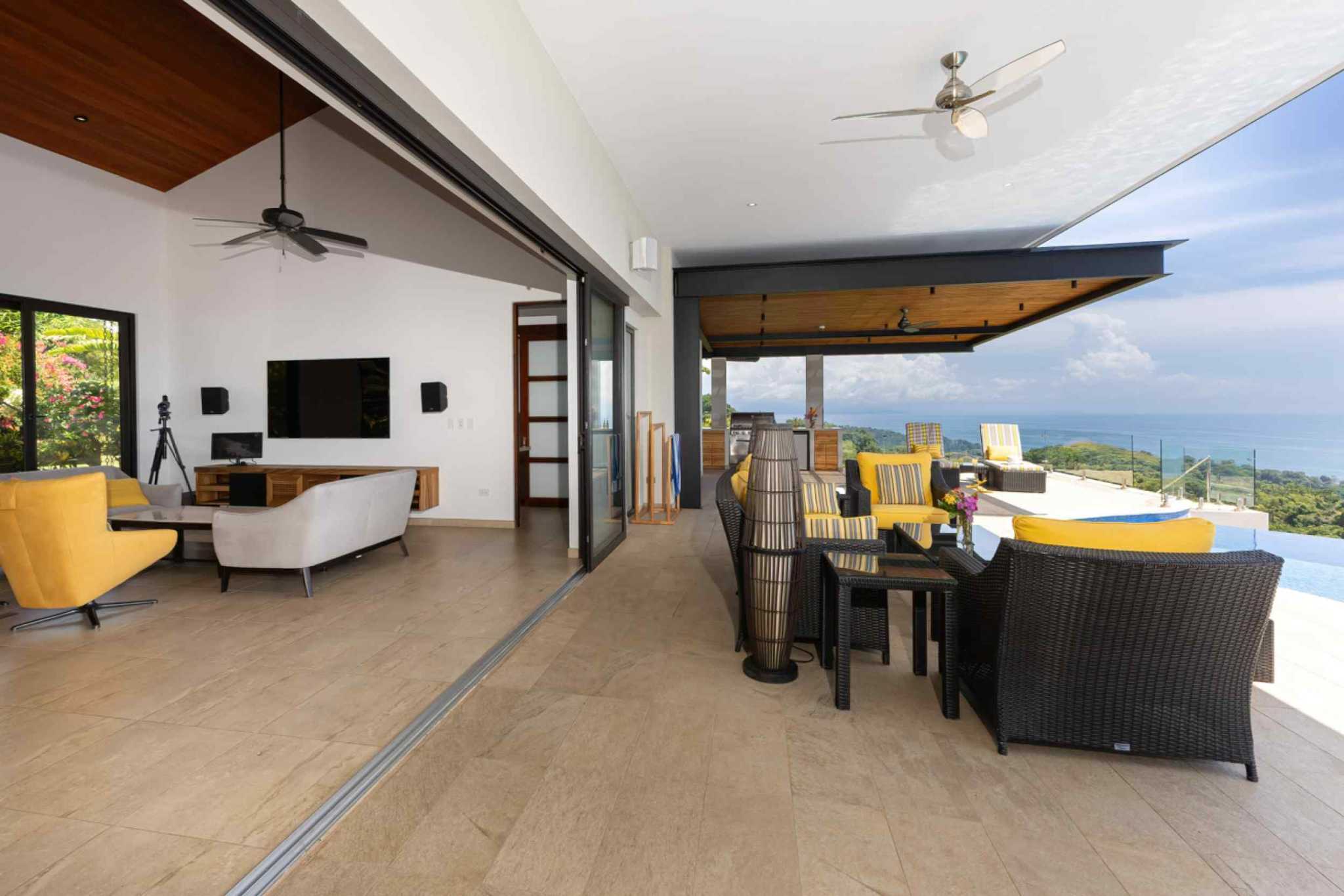 72497-10 Luxury home living area opening to terrace with ocean view furniture in Ojochal, Costa Rica