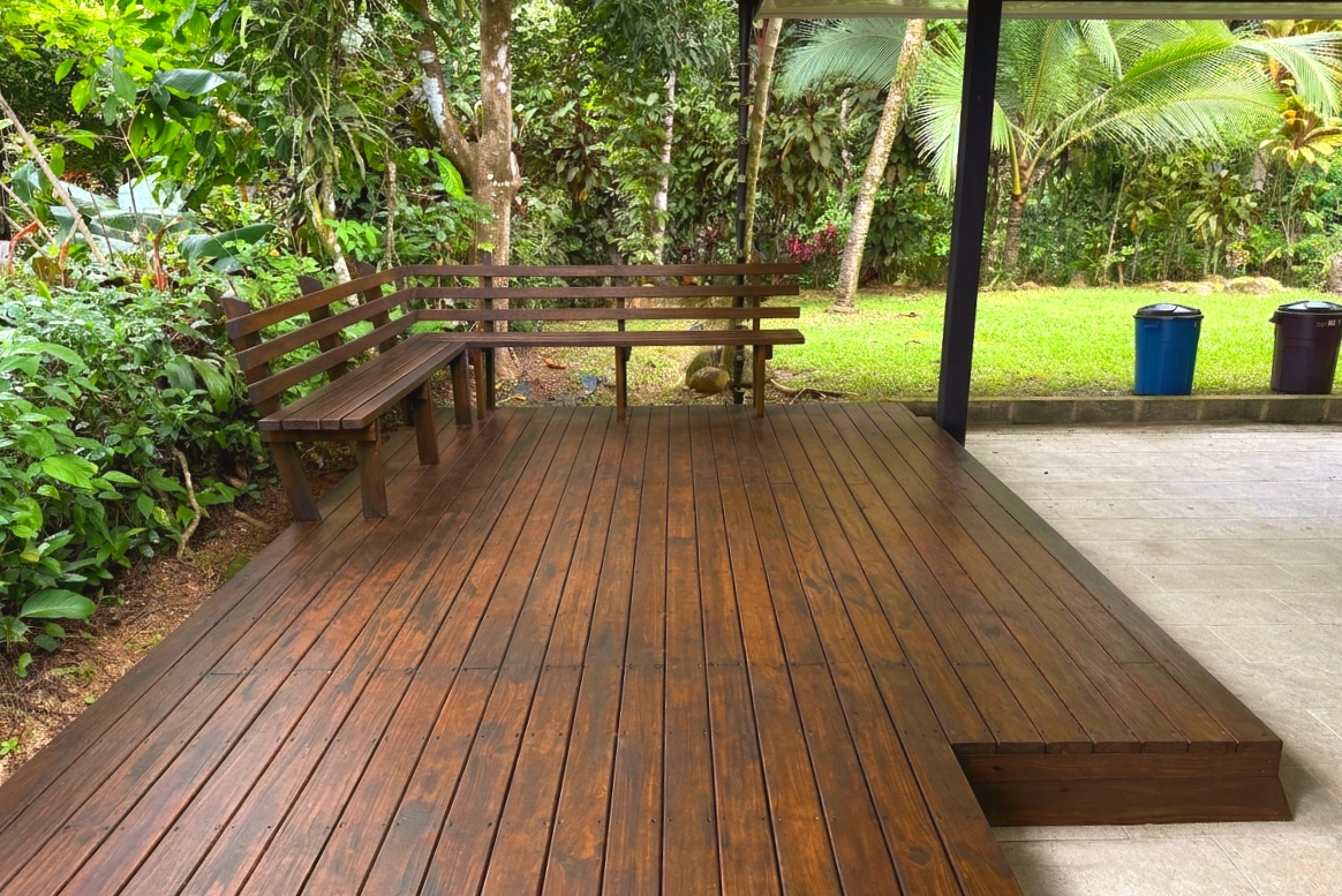 Wooden Deck & Bench Tropical Retreat Home wooden deck with built-in corner bench in Costa Rica