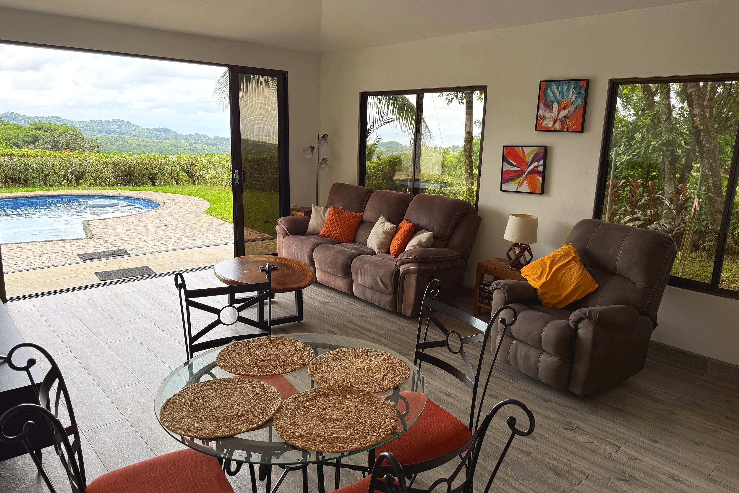 Living Room & Pool View Countryside Home living room with pool view in Costa Rica