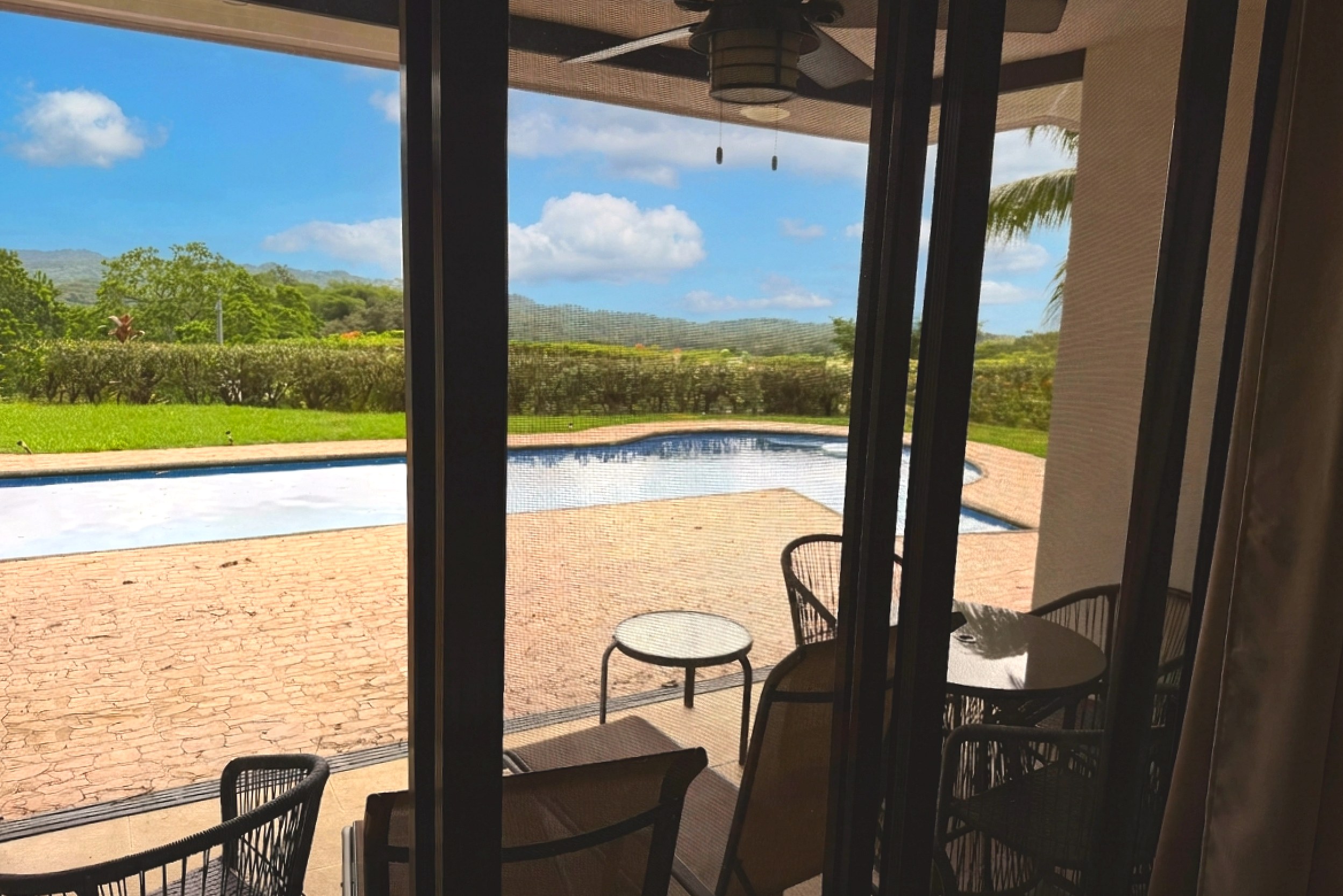 Lanai Pool View Master Bedroom Villa screened lanai view of pool and mountains in Costa Rica