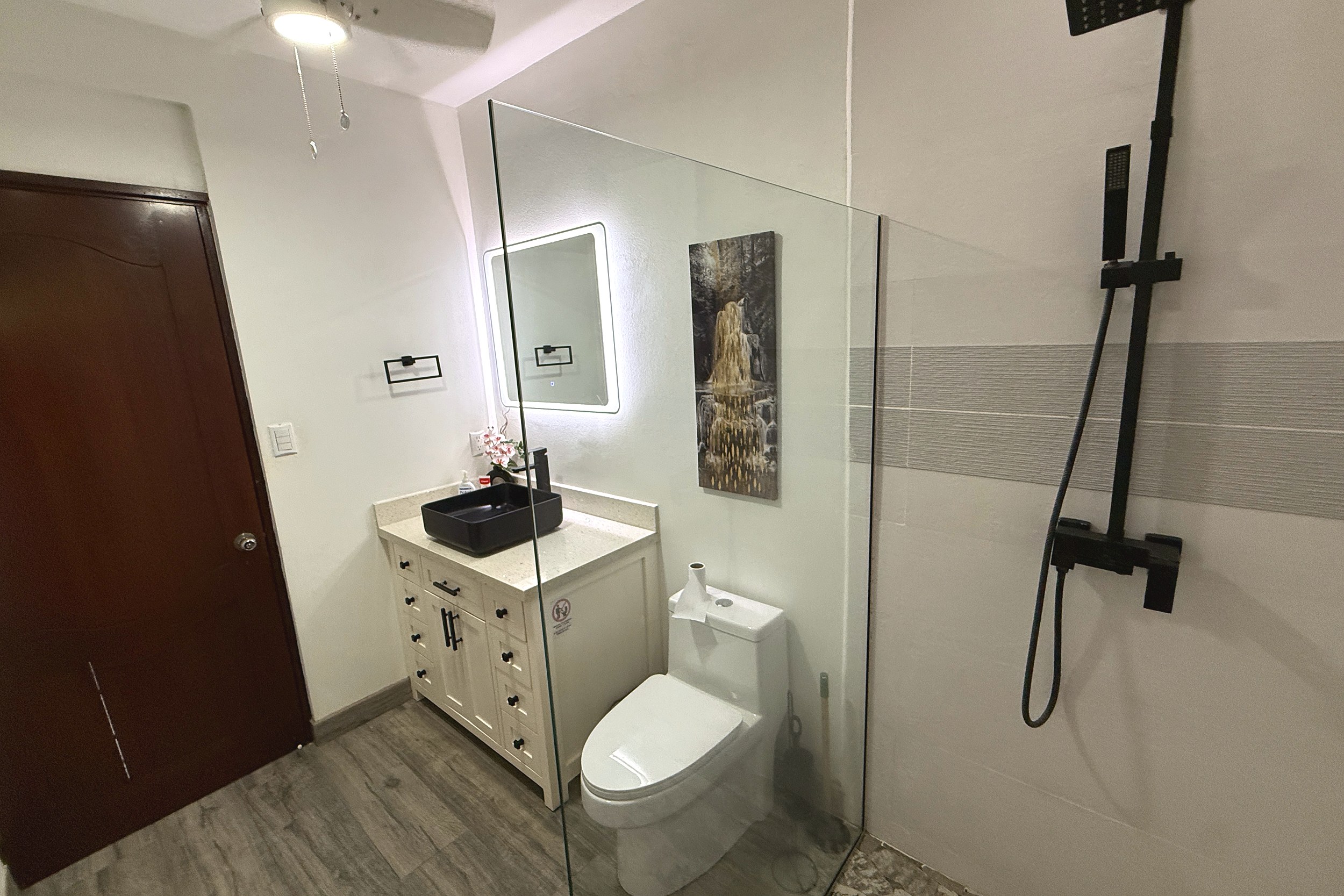 Modern Guest Bathroom Guest Bathroom vanity, toilet and glass shower in Costa Rica
