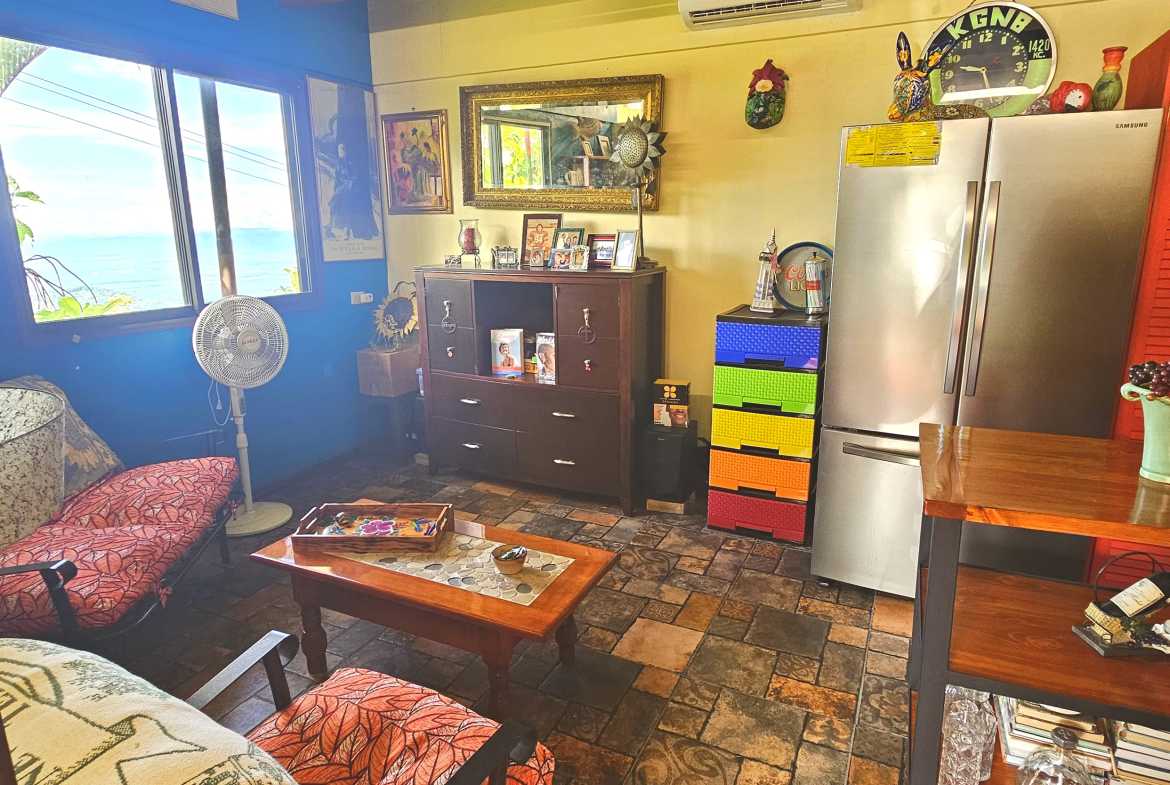 Ocean-View Home with Guesthouse living room with seating in Toucan Valley/Osa Mountain Village, Costa Rica
