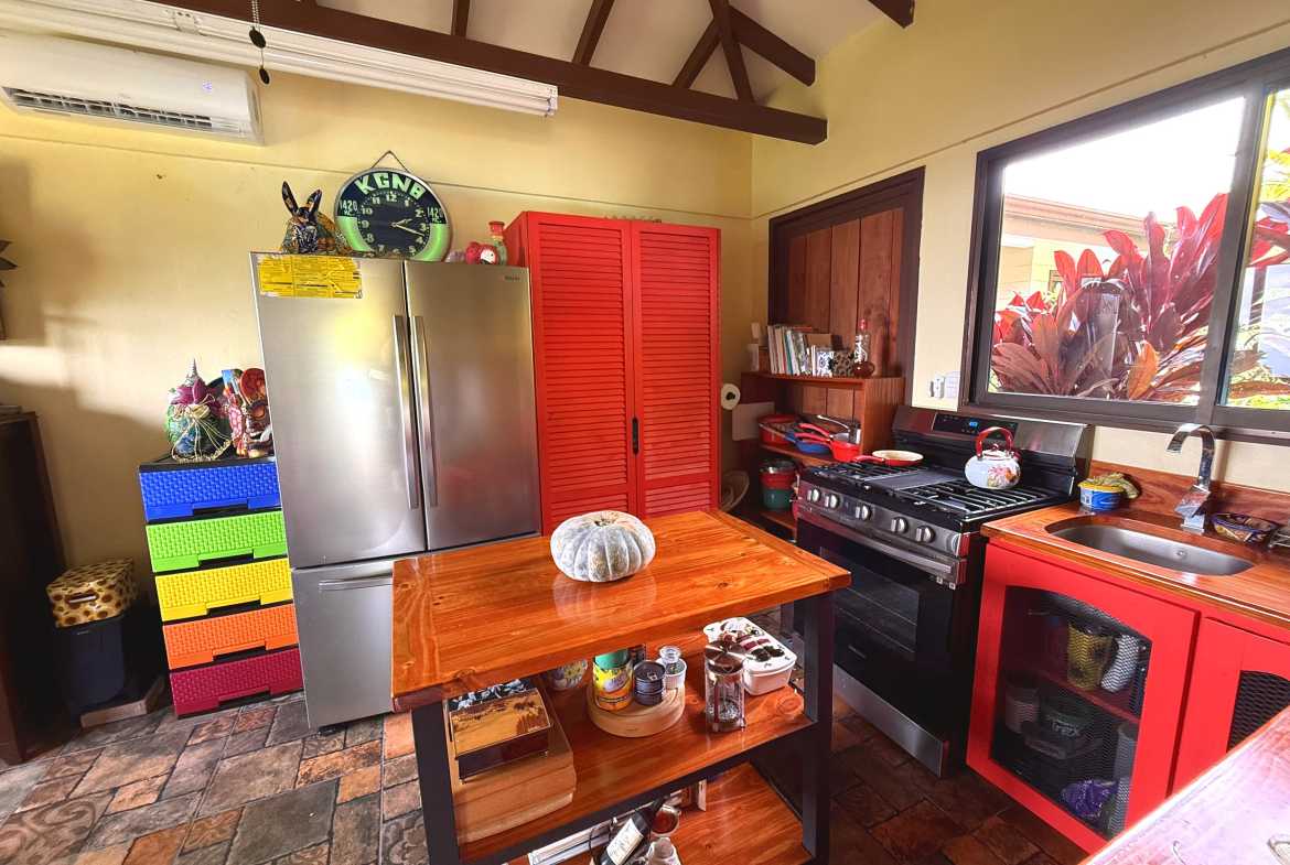 Ocean-View Home with Guesthouse kitchen with wooden island in Toucan Valley/Osa Mountain Village, Costa Rica